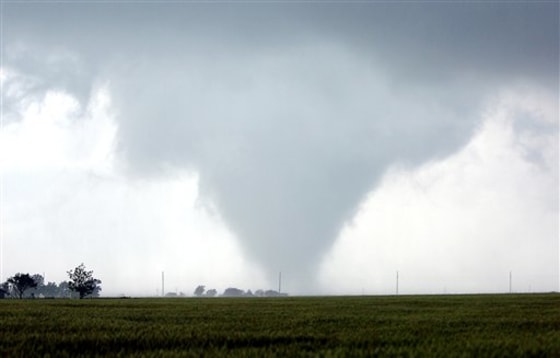 A tornado touches down just north of Hennessey, Okla., on Wednesday near U.S. Highway 81.